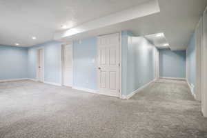 Finished basement featuring carpet and recessed lighting