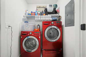 Laundry room with washer and clothes dryer