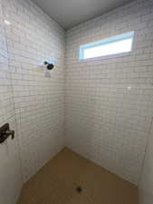 Full bath with a tile shower