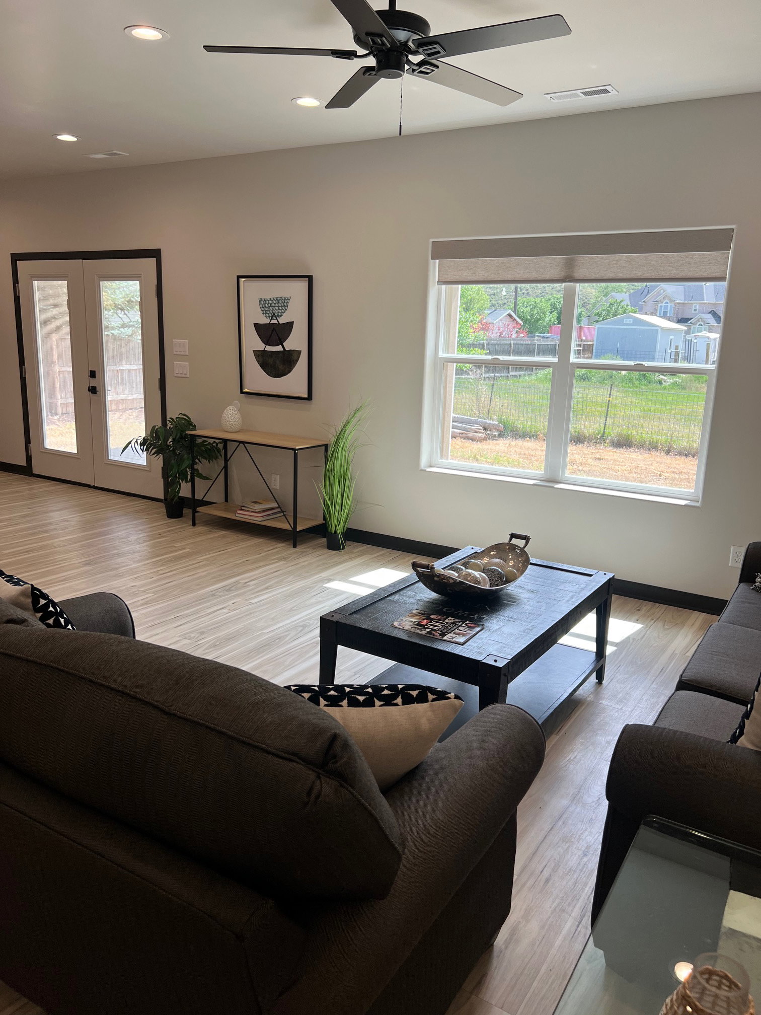 Open concept living space featuring wood-finish flooring, recessed lighting, and a ceiling fan