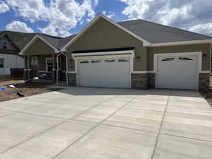 Contemporary stucco exterior with a stone veneer accent
