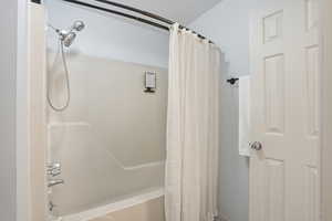 Full bathroom with shower / bath combo