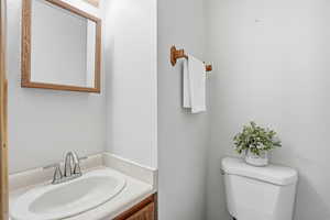 Bathroom featuring vanity and toilet