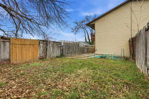 View of fenced backyard