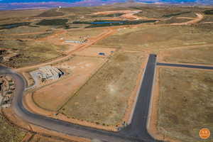 Overview of rural landscape featuring a desert landscape and a mountain backdrop