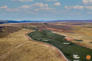 Drone / aerial view of mountains and a golf club