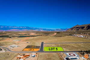 Aerial view of sparsely populated area with a desert landscape and mountains