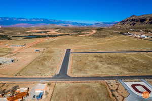 Aerial view of sparsely populated area featuring a desert landscape and mountains