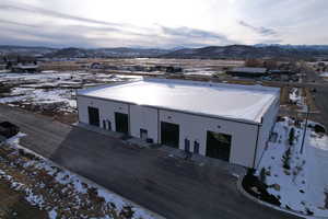 Snow covered property featuring a mountain view