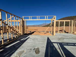 Fenced yard featuring a mountain view