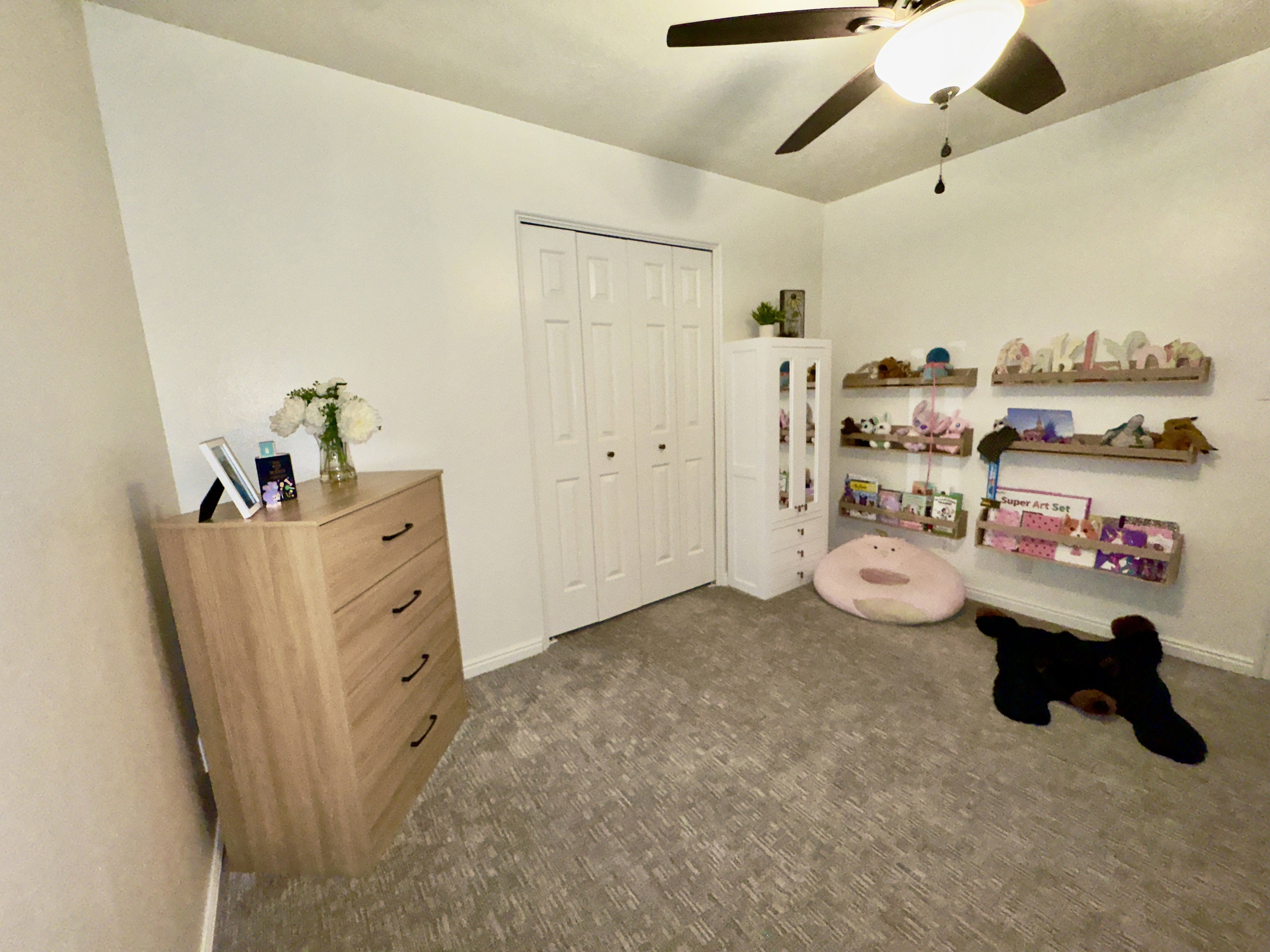 bedroom with ceiling fan and carpet floors