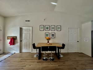 Dining space with wood finished floors