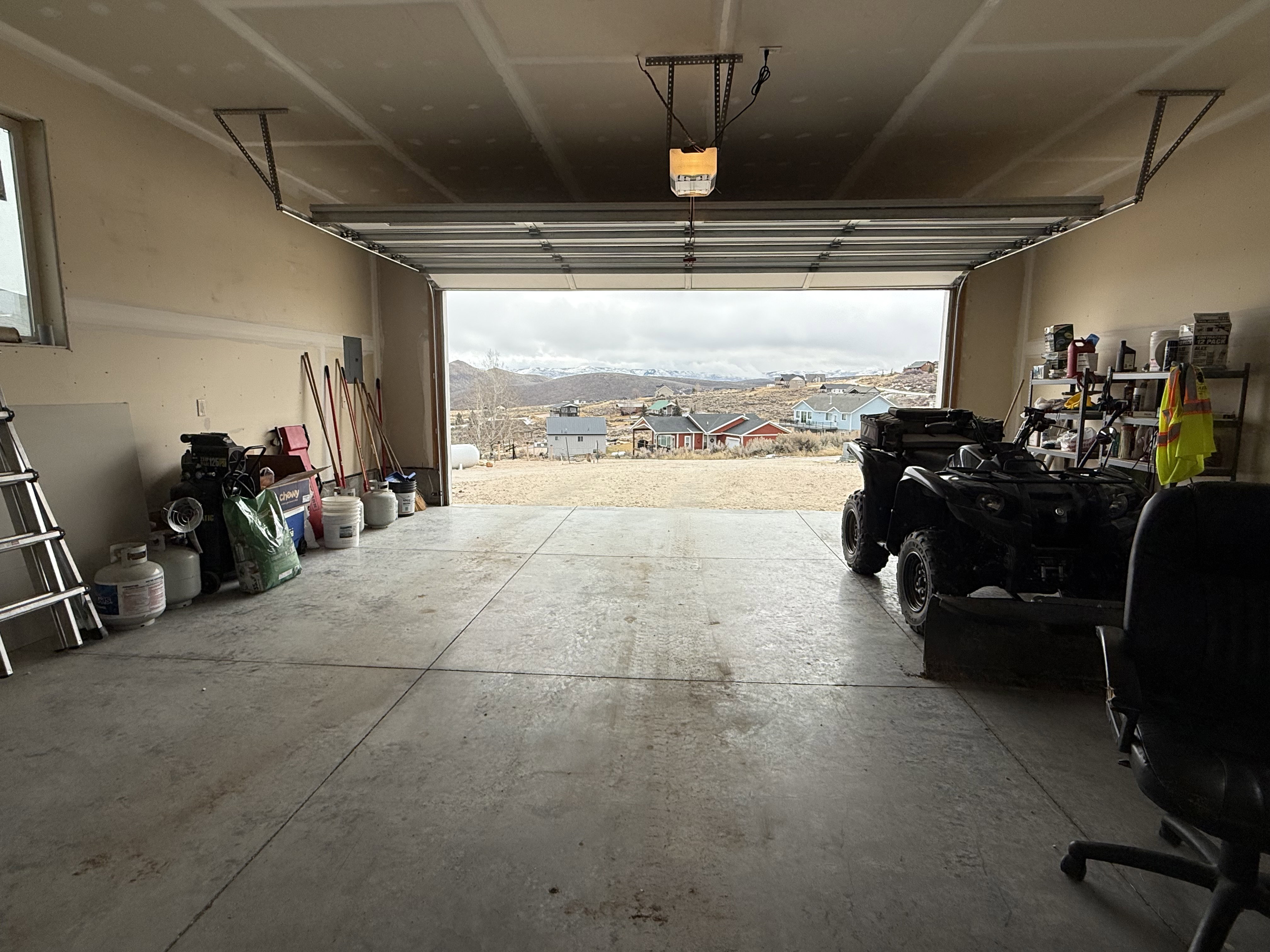 Garage featuring a mountain view and a residential view