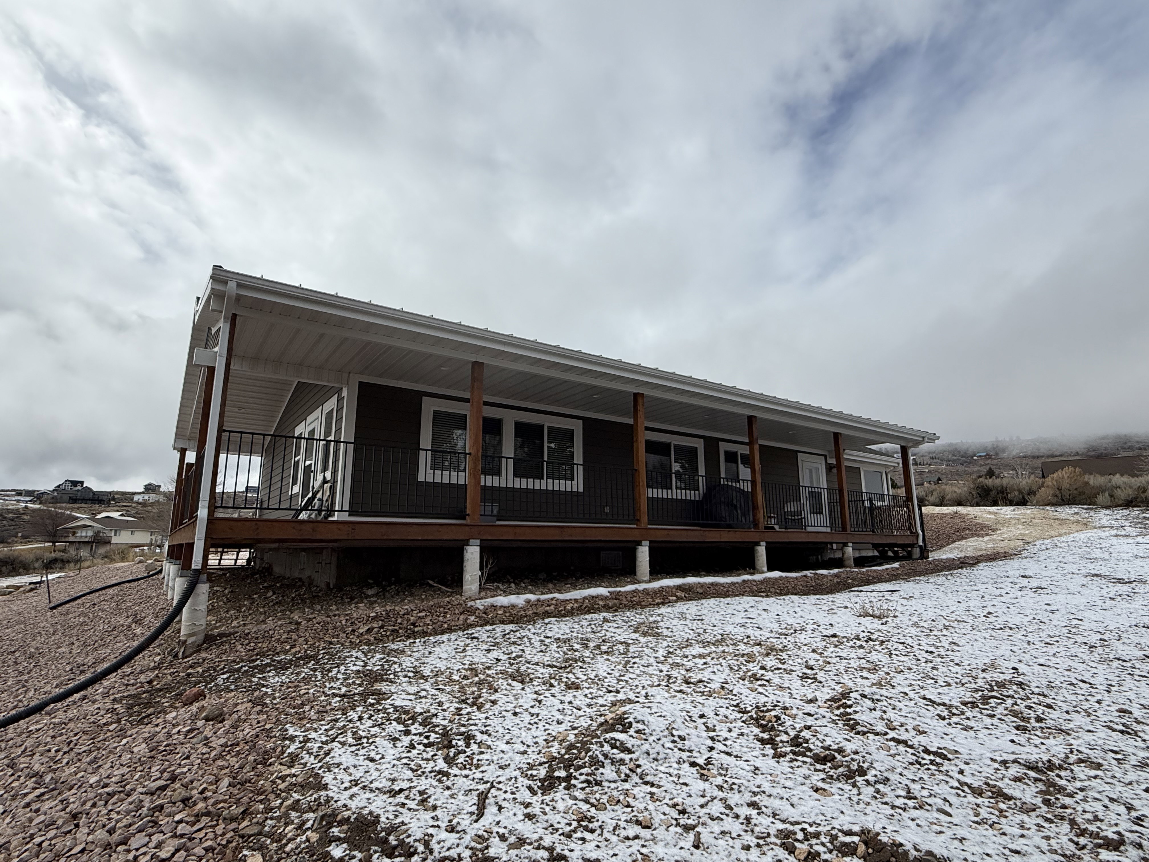 Rear view of house featuring a porch