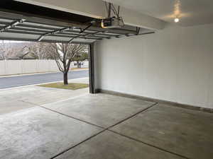 Garage featuring a garage door opener