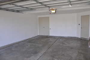 Garage featuring a garage door opener