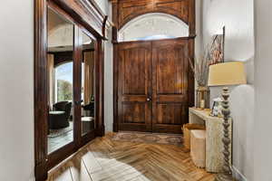 Foyer featuring parquet floors