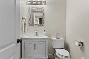 Bathroom featuring toilet and vanity