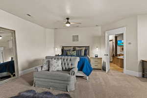 Carpeted bedroom featuring baseboards and a ceiling fan