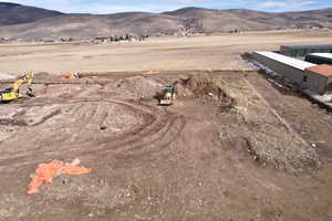 Aerial view of sparsely populated area featuring a mountainous background
