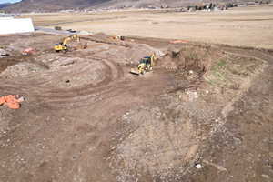Aerial view of sparsely populated area with a mountain backdrop