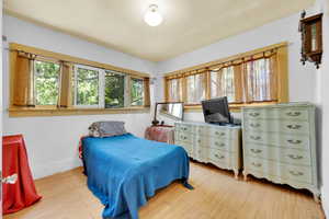 Bedroom with light wood-style floors