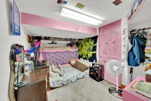 Bedroom featuring a textured ceiling