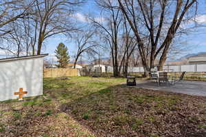 Fenced backyard featuring a patio area
