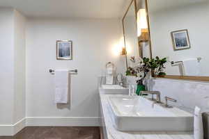 Bathroom with vanity and baseboards