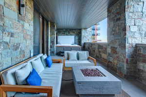 Balcony with an outdoor living space with a fire pit