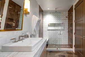 Bathroom featuring a stall shower and vanity