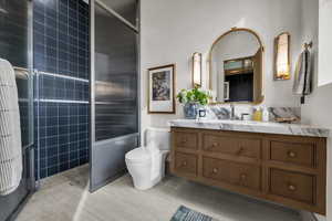 Full bath featuring vanity and a walk in shower