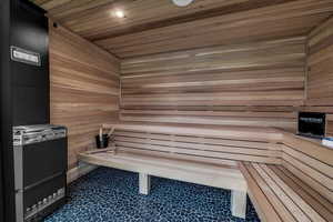 Sauna / steam room with wooden ceiling and wooden walls