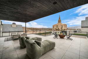 View of patio / terrace with an outdoor living space with a fire pit