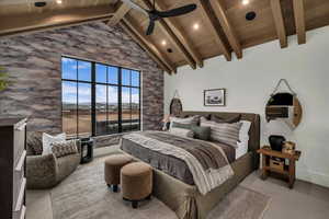 Carpeted bedroom featuring a high wood beamed ceiling and ceiling fan