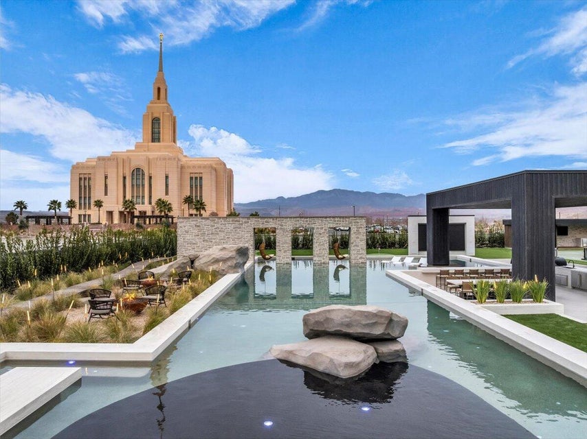 View of swimming pool with a swimming pool, a mountain view, and patio surround