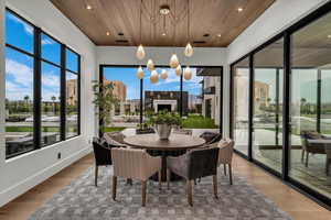 Sunroom featuring hanging lights