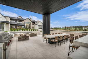 View of patio featuring an outdoor fire pit
