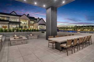 View of patio featuring an outdoor bar and a fire pit