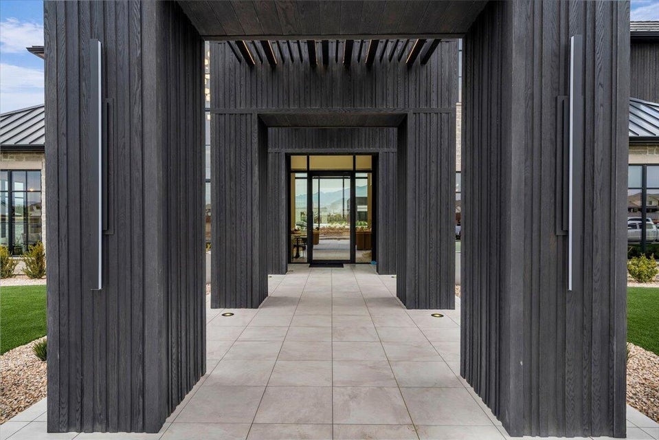Property entrance featuring a standing seam roof