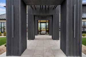 Property entrance featuring a standing seam roof