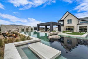 Outdoor pool featuring a patio and a jacuzzi