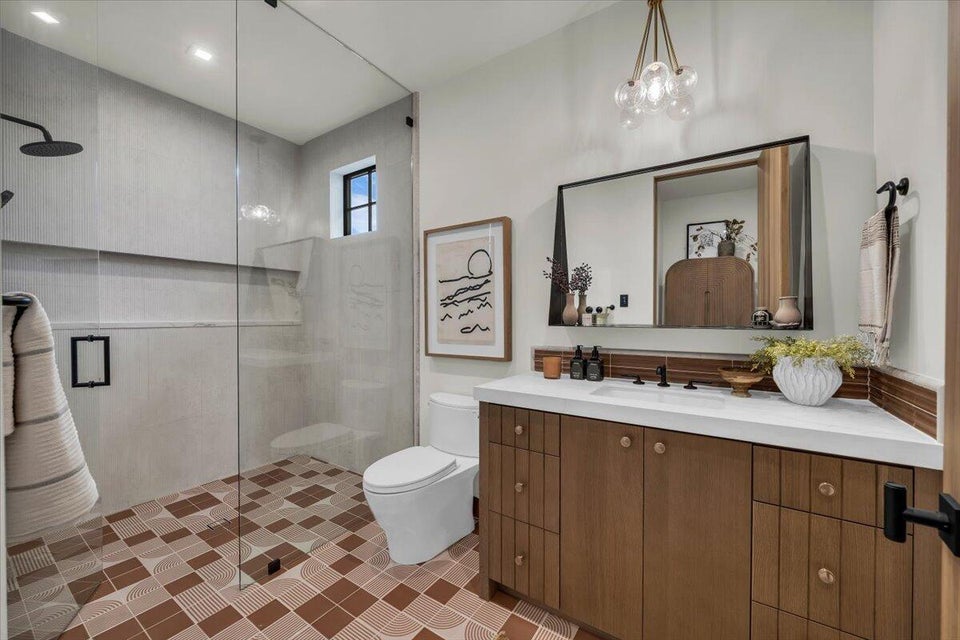 Bathroom featuring walk in shower and vanity
