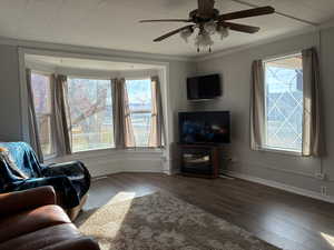 Living area with bay windows; furniture included