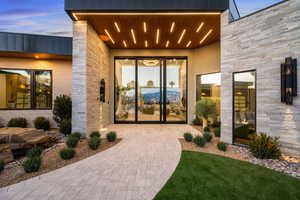 View of exterior entry with stone siding
