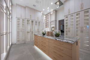 Walk in closet featuring light tile patterned floors