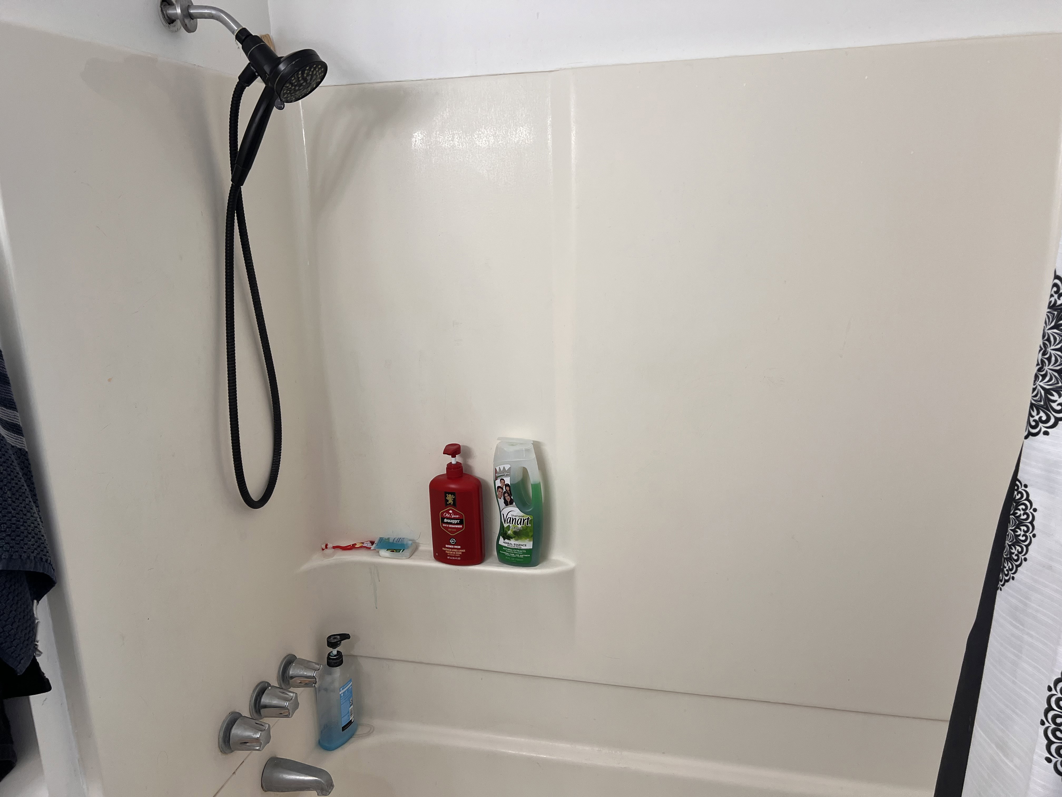 Full bathroom with shower / bath combo with shower curtain