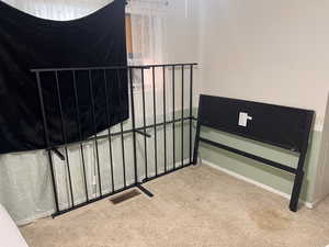 Staircase with carpet floors and baseboards