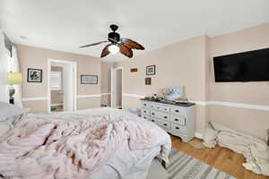 Bedroom featuring light wood-style flooring and a ceiling fan