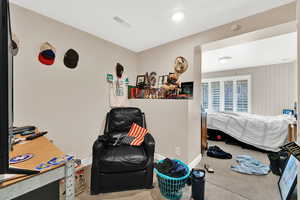 Bedroom with carpet flooring